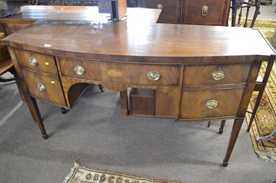 Lot 597 - A Georgian Revival mahogany sideboard of bow...