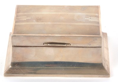 Lot 4 - A hallmarked silver table cigarette box, the...