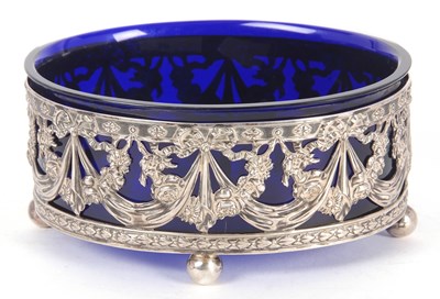 Lot 26 - A continental white metal and blue glass lined...