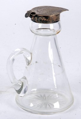 Lot 40 - A George V silver mounted glass whisky tot,...