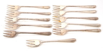 Lot 41 - Eleven George V silver oyster forks,...