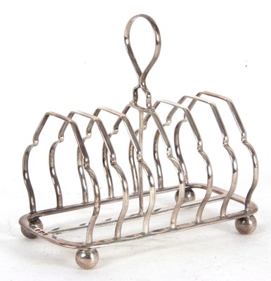 Lot 65 - An Edwardian silver toast rack of angular form,...