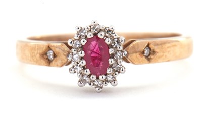 Lot 15 - A 9ct ruby and diamond ring, the oval ruby...