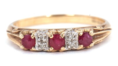 Lot 55 - A 9ct ruby and diamond ring, the three round...