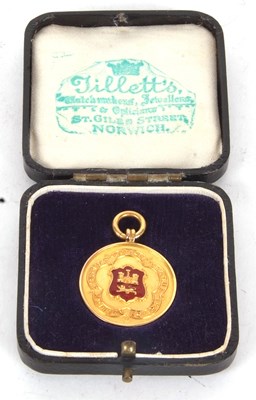 Lot 126 - A 9ct gold and red enamel Norwich & District...