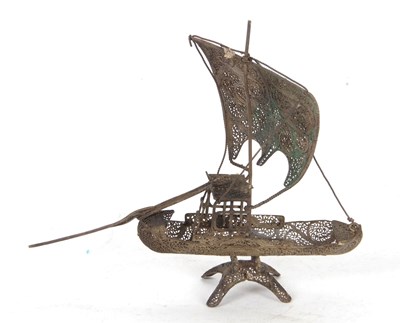 Lot 166 - A filigree white metal model of a Chinese junk...