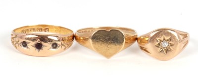 Lot 201 - Three gold rings: to include a three an late...