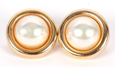 Lot 146 - A pair of Christian Dior earclips, the round...