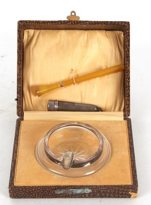 Lot 180 - A boxed glass and silver mounted ashtray, the...