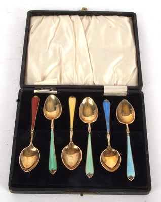 Lot 184 - A cased set of six silver-gilt and coloured...