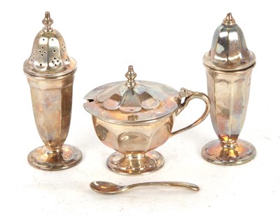 Lot 187 - A cased silver three piece cruet set of...