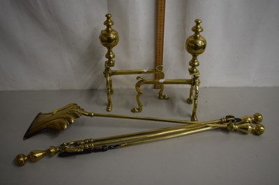 Lot 29 - A set of three brass fire tools and...