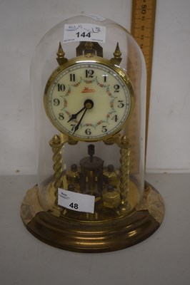 Lot 48 - A brass anniversary clock under glass dome