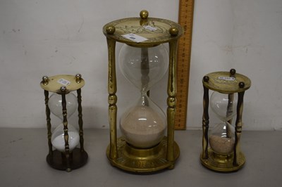 Lot 69 - Three brass mounted sand timers