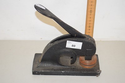 Lot 80 - A vintage iron desk embosser