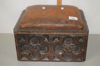 Lot 158 - An oak leather covered stool, the body formed...