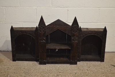 Lot 327 - A continental dark oak shelf cabinet of gothic...