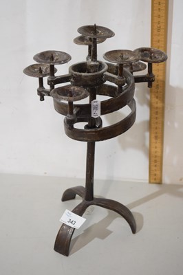 Lot 343 - An iron candelabra