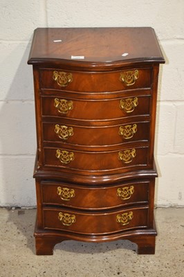 Lot 355 - A reproduction mahogany serpentine front chest...