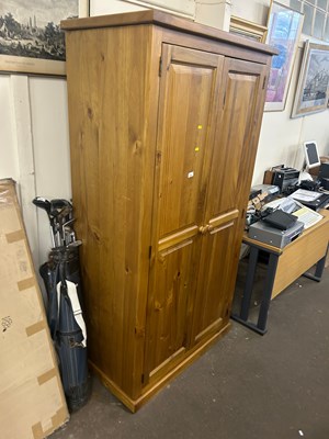 Lot 620 - A modern pine bookcase cabinet