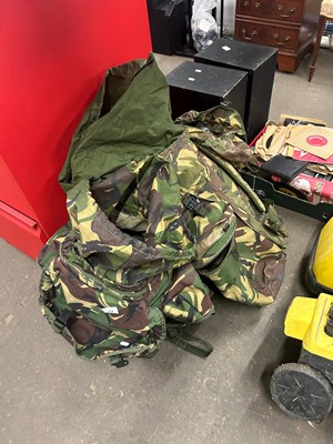 Lot 692 - Two army backpacks with various accessories