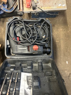 Lot 723 - An electric drill and a router