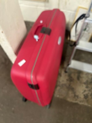 Lot 763 - A red suitcase and suite bag