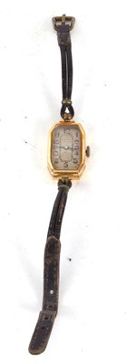 Lot 251 - A yellow metal lady's tank style wristwatch,...