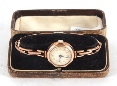 Lot 252 - A 9ct gold cased lady's wristwatch on a yellow...