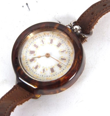 Lot 279 - A white metal pocket watch with a watch strap...