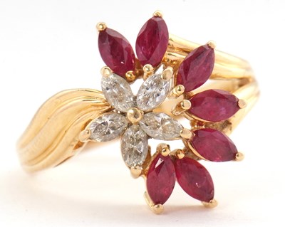 Lot 26 - An 18ct ruby and diamond cluster ring, set...