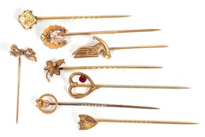 Lot 217 - Eight gold and yellow metal stick pins: to...