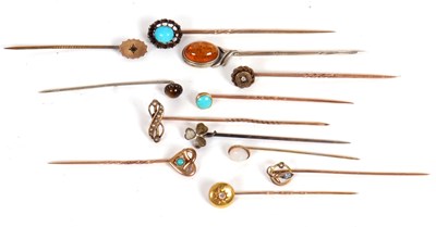 Lot 223 - Twelve assorted stick pins: to include diamond,...