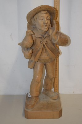 Lot 40 - A carved wooden figure of a street seller