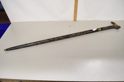 Lot 43A - A carved ebonised sword stick