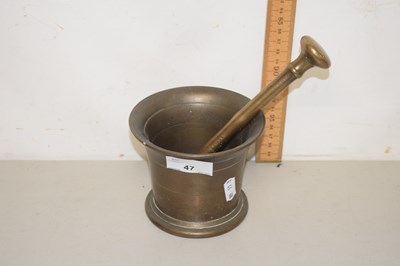 Lot 47 - A brass mortar and pestle