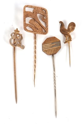 Lot 219 - Four stick pins: to include a modern square...