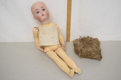 Lot 82 - A box containing a vintage doll marked...