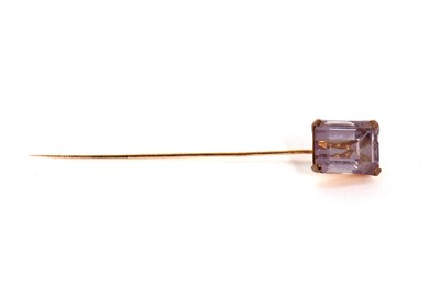 Lot 216 - A pink quartz stick pin, the emerald cut pink...