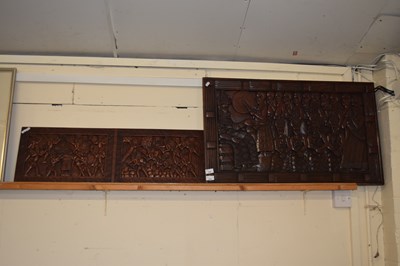 Lot 228 - Two relief carved wooden panels of tribal scenes