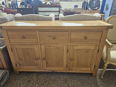 Lot 275 - A three cupboard, three drawer pine sideboard