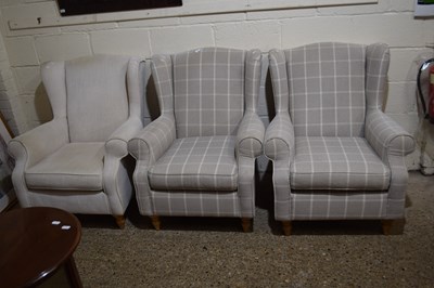 Lot 280 - A pair of beige checked modern wingback...