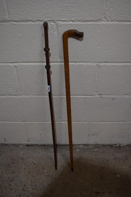 Lot 317 - A carved hardwood walking stick with animal...