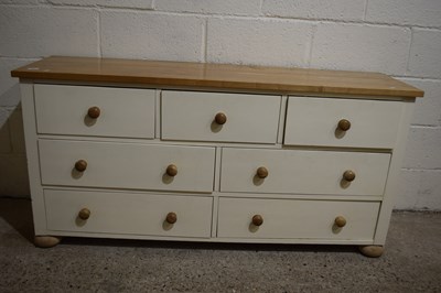 Lot 306 - A pine topped cream sideboard of three short...