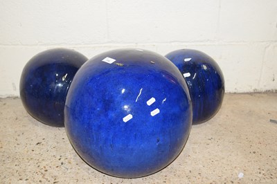 Lot 316 - Three deep blue glazed garden orbs