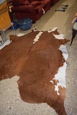 Lot 317 - A cow skin rug