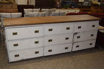 Lot 324 - A large pine counter of three sets of three...