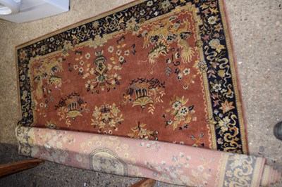 Lot 321 - An orange ground Chinese style rug