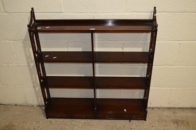 Lot 361 - A three tier two drawer mahogany wall shelf