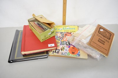 Lot 94 - Two stamp albums and a quantity of stamps